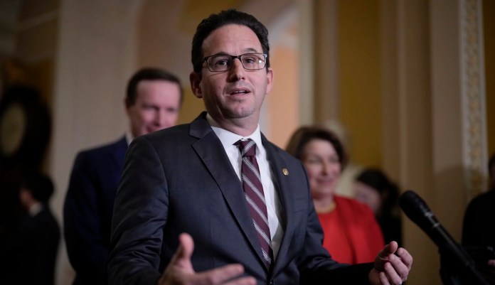 Sen. Brian Schatz, D-Hawaii, speaks with reporters about President Donald Trump's agenda following a Democratic policy lunch, at the Capitol in Washington, Tuesday, Jan. 21, 2025. (AP Photo/J. Scott Applewhite)