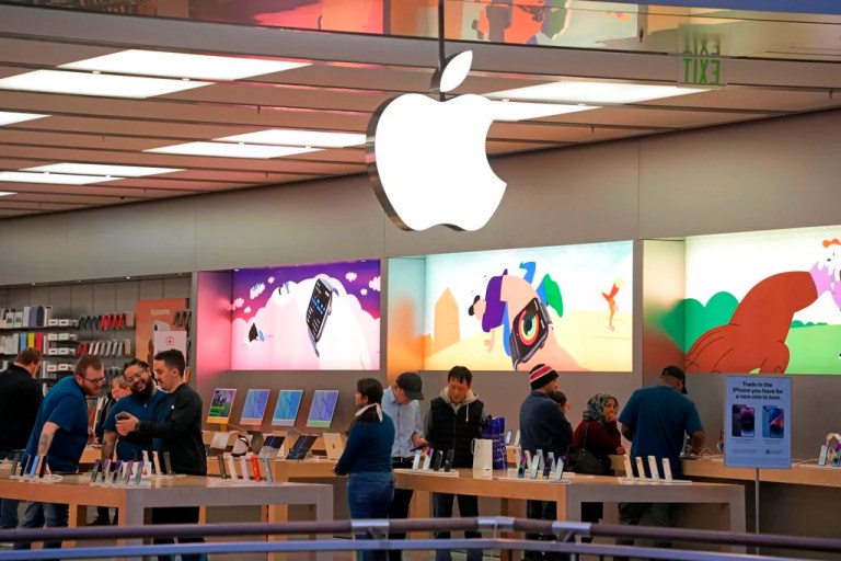 Customers shop in an Apple store in Pittsburgh Jan. 30, 2023.