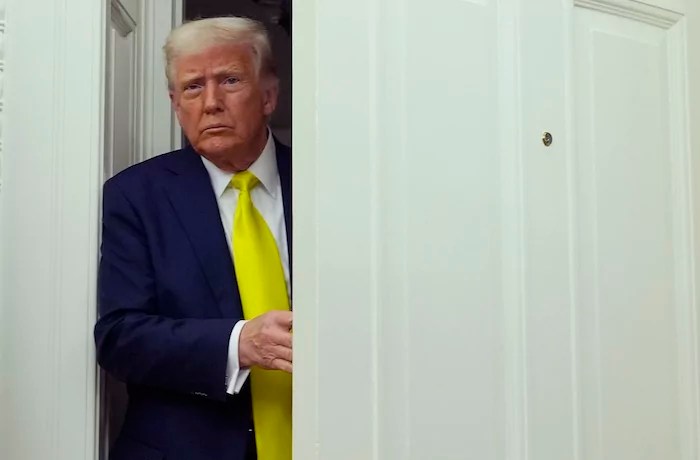 President Donald Trump arrives at a swearing in ceremony.