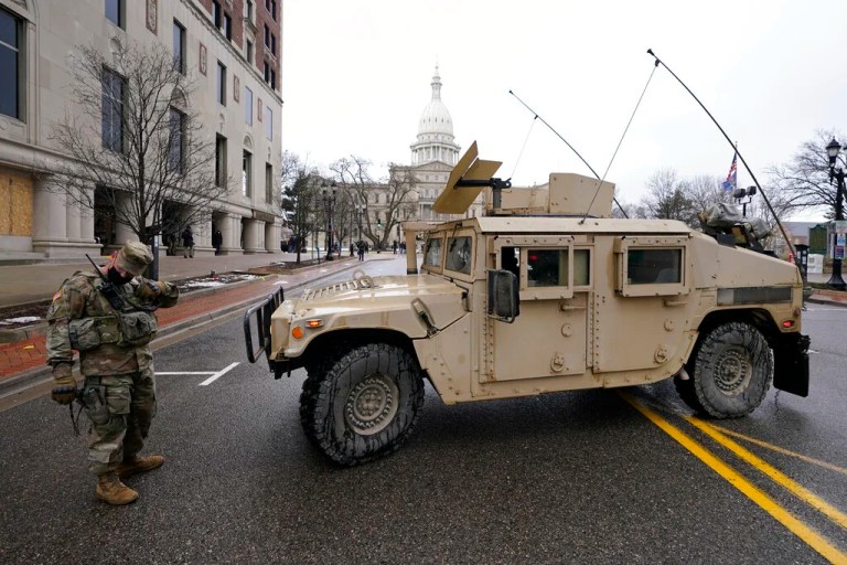 A member of the Michigan National Guard parks near the State Capitol in Lansing, Mich., Sunday, Jan. 17, 2021.