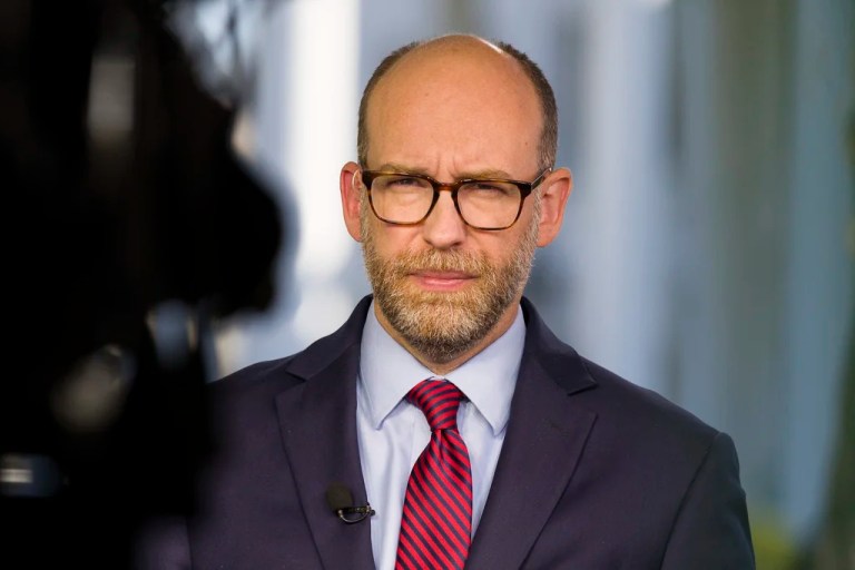Acting director of Office of Management and Budget Russ Vought listens during a television interview at the White House, Oct. 21, 2019, in Washington. Former President Donald Trump is seeking to distance himself from a plan for a massive overhaul of the federal government drafted by some of his administration officials, including Vought. Some of these men are expected to take high-level roles if the Republican presumptive nominee is elected back into the White House. Trump is saying on Truth Social that he 