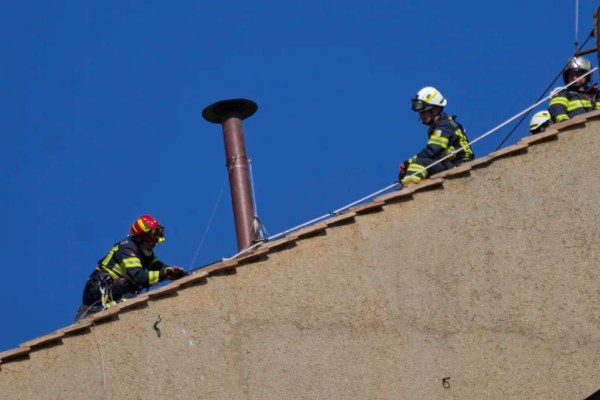 Sistine Chapel chimney installed by Vatican fire corps ahead of conclave