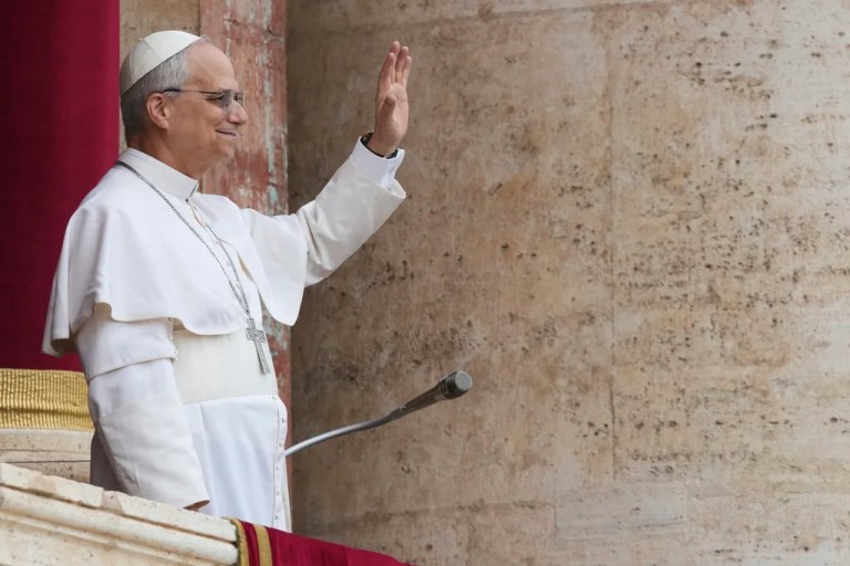 Pope Leo XIV appears at the central balcony of St. Peter's Basilica for his first Sunday blessing after his election in St. Peter's Square at the Vatican, Sunday, May 11, 2025.