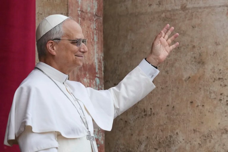 Pope Leo XIV appears at the central balcony of St. Peter's Basilica for his first Sunday blessing after his election, in St. Peter's Square at the Vatican, Sunday, May 11, 2025.