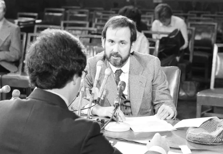 Michael Ledeen, right, executive editor of the Washington Quarterly, gives a deposition to the Senate subcommittee to investigate individuals representing the interests of foreign governments, Oct. 28, 1980, in Washington, D.C.