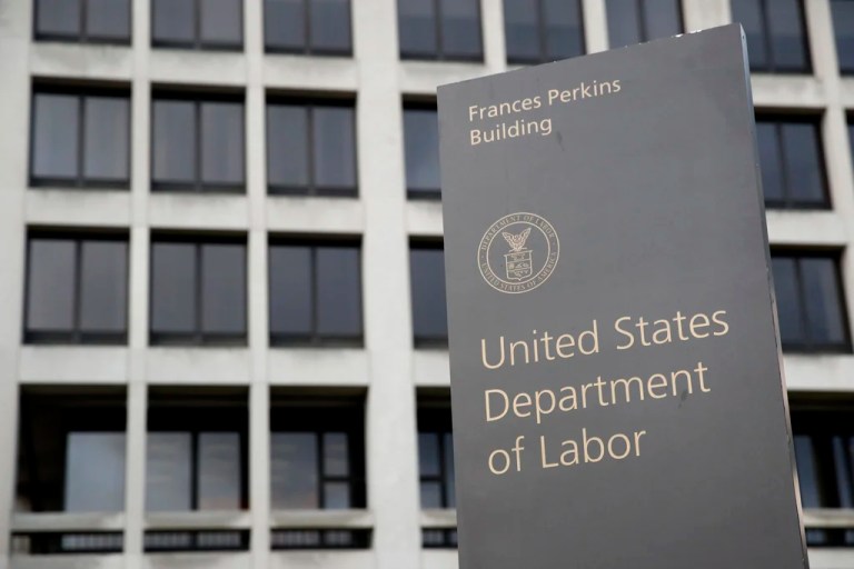 A sign stands outside the U.S. Department of Labor's headquarters.
