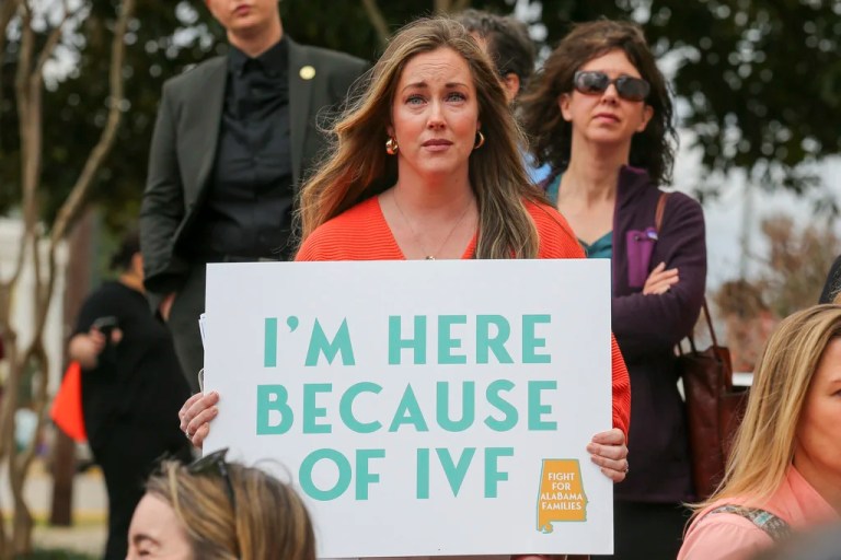 Sarah Brown, from Birmingham, Ala., holds a sign in support of IVF treatments during a rally advocating for IVF rights outside the Alabama State House on Wednesday, Feb. 28, 2024 in Montgomery, Ala. Brown has two children, age three and one, who were conceived using IVF at Birmingham Fertility center. (Stew Milne/AP Images for RESOLVE: The National Infertility Association)