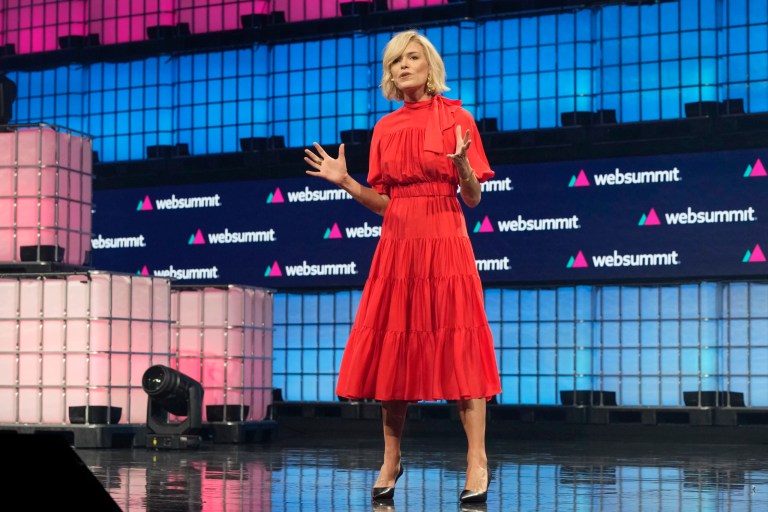 Katherine Maher, the new CEO of Web Summit, gestures during her speech opening the technology conference, in Lisbon, Monday, Nov. 13, 2023. The four-day Web Summit conference opened Monday.