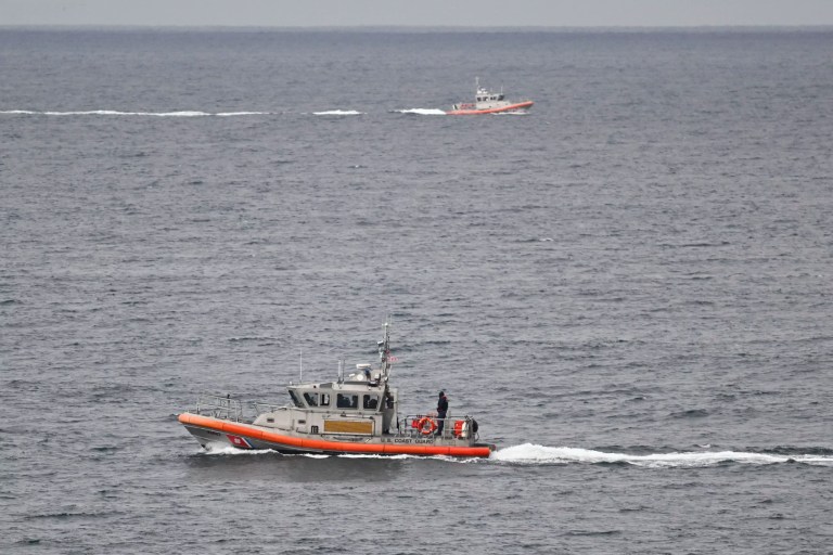 U.S. Coast Guard boats look for survivors after a boat capsized in the surf, Monday, May 5, 2025, at Torrey Pines State beach in San Diego, California.