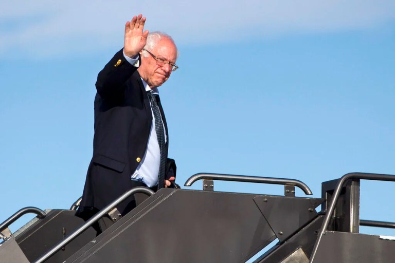 Sen. Bernie Sanders (I-VT), Democratic presidential candidate, waves as he boards his plane in Denver, Colorado, Monday, Feb. 29, 2016, en route to Minnesota.