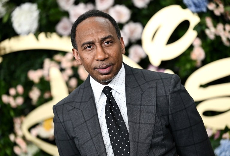 Stephen A. Smith stands in front of the Disney logo.