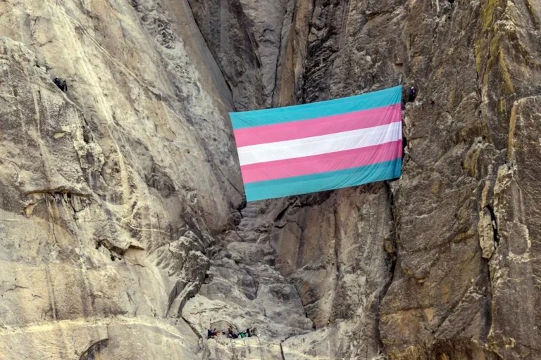 A group of climbers unfurl a trans pride flag on El Capitan in Yosemite National Park, Calif., on Tuesday, May 20, 2025.