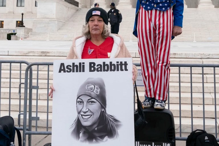 Micki Witthoeft, center, mother of Ashli Babbitt, the woman fatally shot by police inside the Capitol during the Jan. 6, 2021, riot, joins protesters outside of the Supreme Court on the second anniversary of the Jan. 6 assault on the Capitol, in Washington, Friday, Jan. 6, 2023.