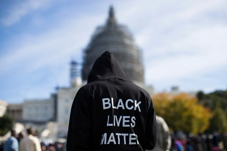 FILE - Neal Blair, of Augusta, Ga., wears a hoodie reading 