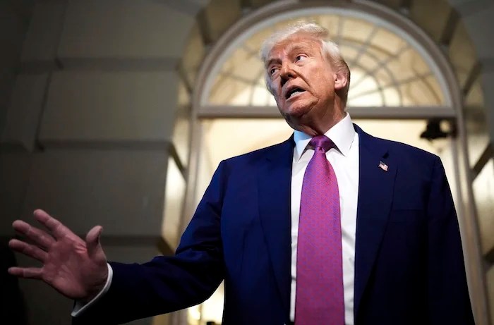 President Donald Trump speaks to reporters after departing a House Republican conference meeting,