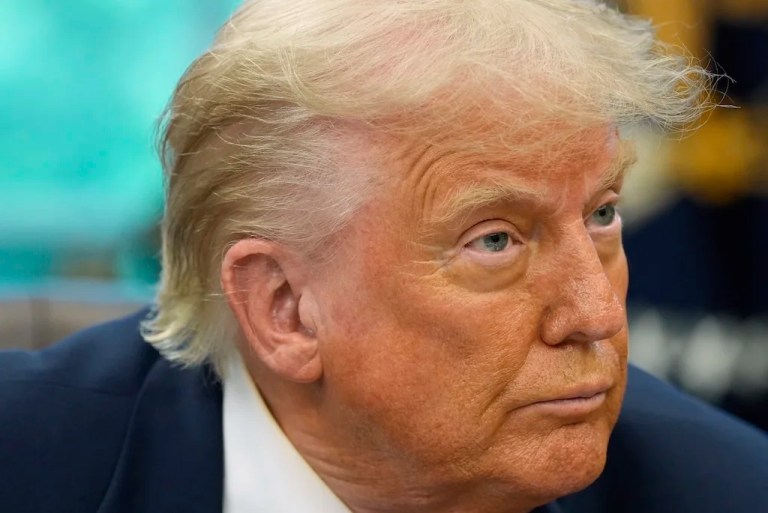 President Donald Trump speaks with reporters as he signs executive orders and proclamations in the Oval Office of the White House, Monday, May 5, 2025, in Washington.