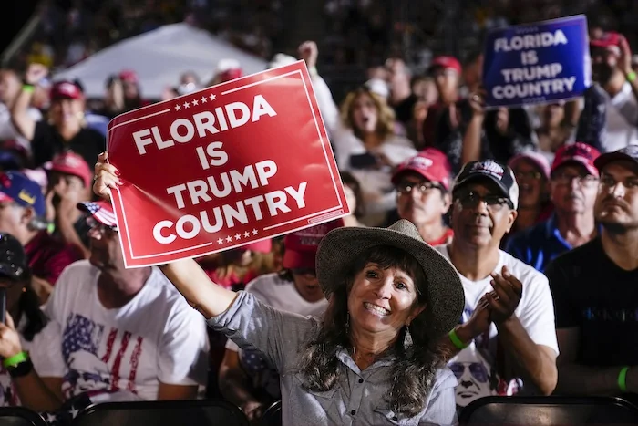 Attendees show their support for former President Donald Trump during a campaign rally in Hialeah, Florida, Wednesday, Nov. 8, 2023.