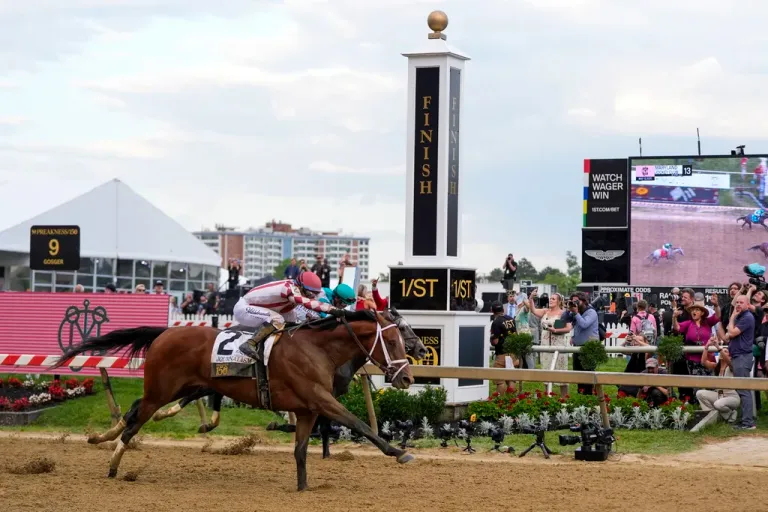 Umberto Rispoli, atop Journalism, left, edges out Luis Saez, atop Gosger, to win the 150th running of the Preakness Stakes horse race Saturday, May 17, 2025, at Pimlico Race Course in Baltimore.