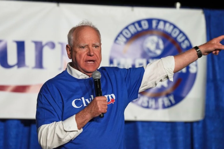 Minnesota Gov. Tim Walz speaks to attendees at Rep. Jim Clyburn's World Famous Fish Fry, Friday, May 30, 2025, in Columbia, S.C. (AP Photo/Meg Kinnard)