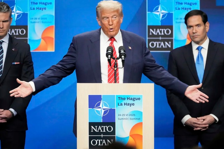 President Donald Trump gestures standing between Secretary of State Marco Rubio, right, and Defense Secretary Pete Hegseth during a press conference after the plenary session at the NATO summit in The Hague, Netherlands, Wednesday, June 25, 2025.