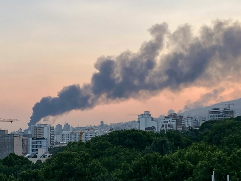 Smoke rises from the building of Iran's state-run television after an Israeli strike in Tehran, Monday, June 16, 2025.