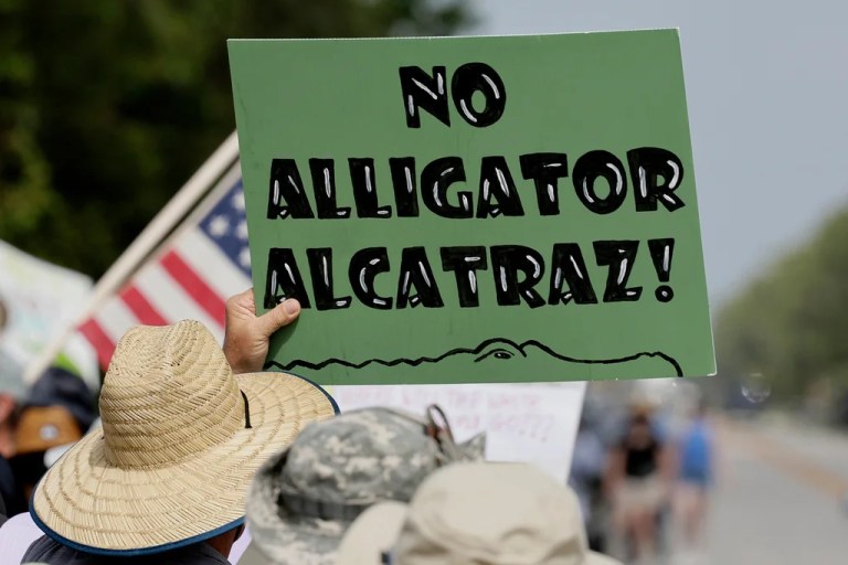 Environmental advocates and protesters at the Dade-Collier Training and Transition Airport on Tamiami Trail E, Ochopee, Fla., on Saturday, June 28, 2025, object to the 
