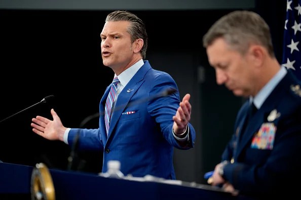U.S. Defense Secretary Pete Hegseth (L) accompanied by Chairman of the Joint Chiefs of Staff Air Force Gen. Dan Caine (R), speaks during a news conference at the Pentagon on June 26, 2025 in Arlington, Virginia. Top officials from the Department of Defense gave an update after three Iranian nuclear facilities were struck by the U.S. military last weekend and Iran countered by launching missiles at Al Udeid Air Base in Qatar.