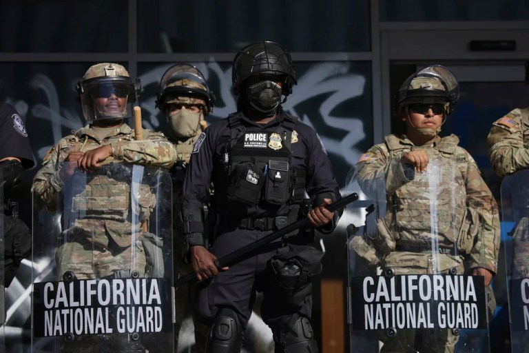 Customs and Border Protection officers and National Guard soldiers are posted at the entrances of the Federal Building in Los Angeles while protesters rally during a demonstration in response to a series of Immigration and Customs Enforcement raids throughout the country, on Tuesday, June 10th, 2025.