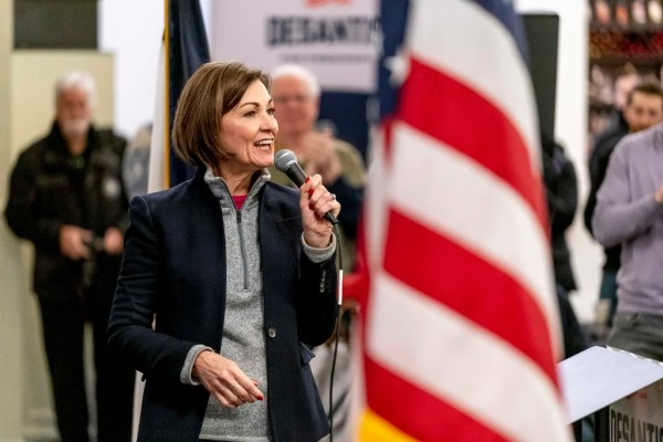 Kim Reynolds approves bill allowing Iowa poll workers to question voters’ citizenship