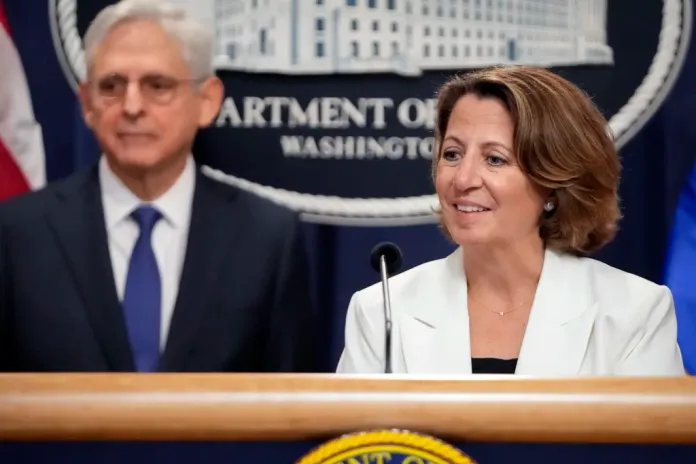 Deputy Attorney General Lisa Monaco speaks with reporters about an antitrust lawsuit against real estate software company RealPage during a news conference at the Department of Justice, Friday, Aug. 23, 2024, in Washington. At left is Attorney General Merrick Garland. (AP Photo/Mark Schiefelbein)