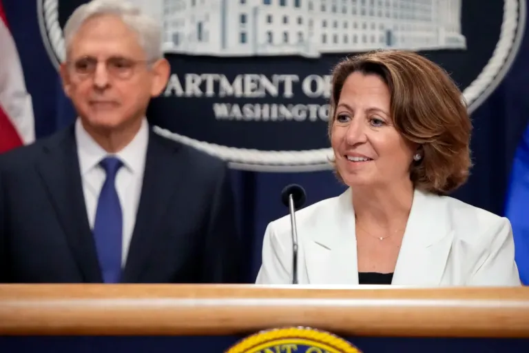 Deputy Attorney General Lisa Monaco speaks with reporters about an antitrust lawsuit against real estate software company RealPage during a news conference at the Department of Justice, Friday, Aug. 23, 2024, in Washington. At left is Attorney General Merrick Garland. (AP Photo/Mark Schiefelbein)