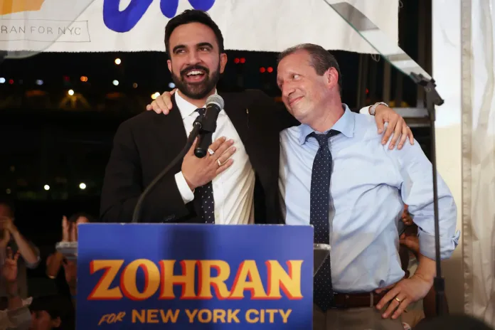 Mamdani and Brad Lander at a rally.
