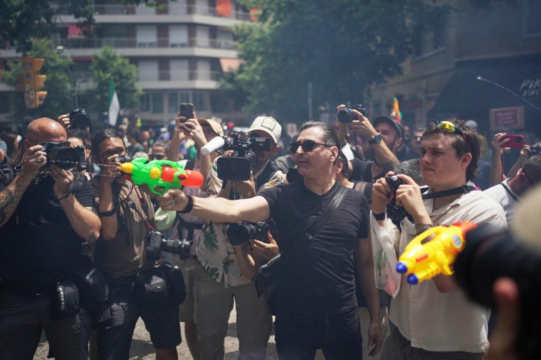 Anti-tourism protesters in Europe are using water guns on tourists