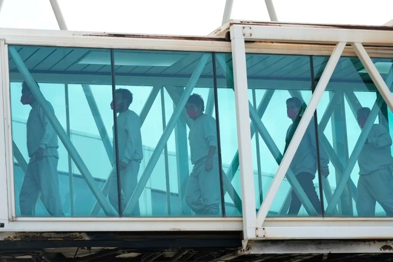 Venezuelan migrants deported from the United States deplane at the Simon Bolivar International Airport in Maiquetia, Venezuela, Friday, May 2, 2025. (AP Photo/Ariana Cubillos)