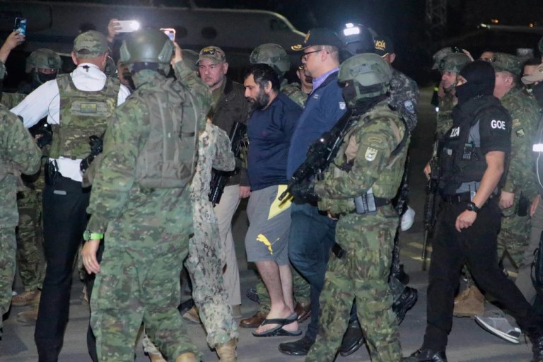 Escorted by soldiers and police officers, Adolfo 