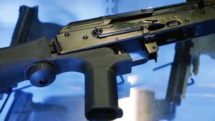 In this Oct. 4, 2017 file photo, a little-known device called a "bump stock" is attached to a semi-automatic rifle at the Gun Vault store and shooting range in South Jordan, Utah. New federal rules would be the "the smartest, quickest" way to regulate the device the gunman in the Las Vegas massacre used to heighten his firepower, House Speaker Paul Ryan said Wednesday, Oct. 11 in remarks that suggested Congress was unlikely to act first. It remains unclear, however, what if any action the federal Bureau of Alcohol, Tobacco, Firearms and Explosives will take on so-called bump stocks.