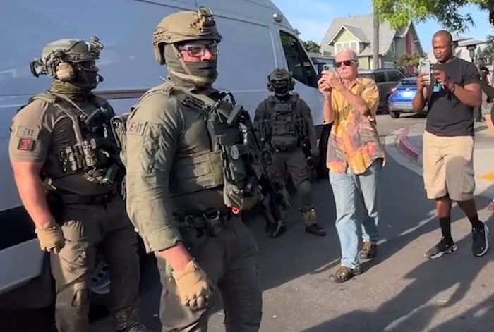 U.S. Immigration and Customs Enforcement agents execute a criminal search warrant on May 30, 2025, at Buona Forchetta in San Diego, Calif. (Lara Azevedo-McCaffrey/KPBS via AP)