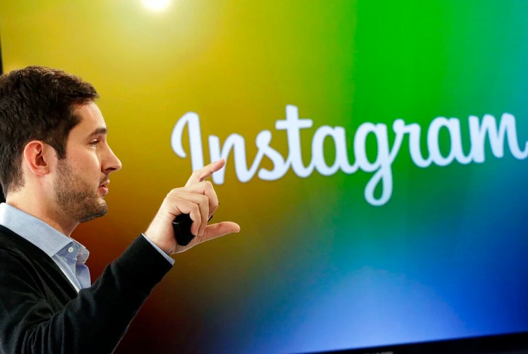 Instagram co-founder Kevin Systrom announces Instagram Direct, a new way to send selected photos and video messages to friends, at a news conference, Thursday, Dec. 12, 2013 in New York. (AP Photo/Mark Lennihan)