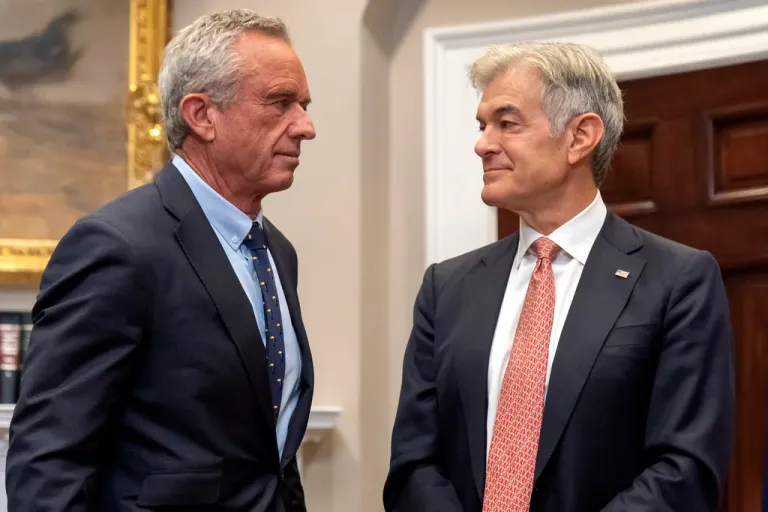 Health and Human Services Secretary Robert F. Kennedy Jr., left, and Dr. Mehmet Oz, administrator of the Centers for Medicare & Medicaid Services, talk before an event with President Donald Trump in the Roosevelt Room at the White House, Monday, May 12, 2025, in Washington. (AP Photo/Mark Schiefelbein)