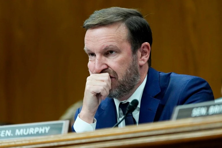 Sen. Chris Murphy, D-Conn., listens as Homeland Security Secretary Kristi Noem speaks during a Senate Appropriations Subcommittee on Homeland Security oversight hearing, Thursday, May 8, 2025, on Capitol Hill in Washington. (AP Photo/Julia Demaree Nikhinson)