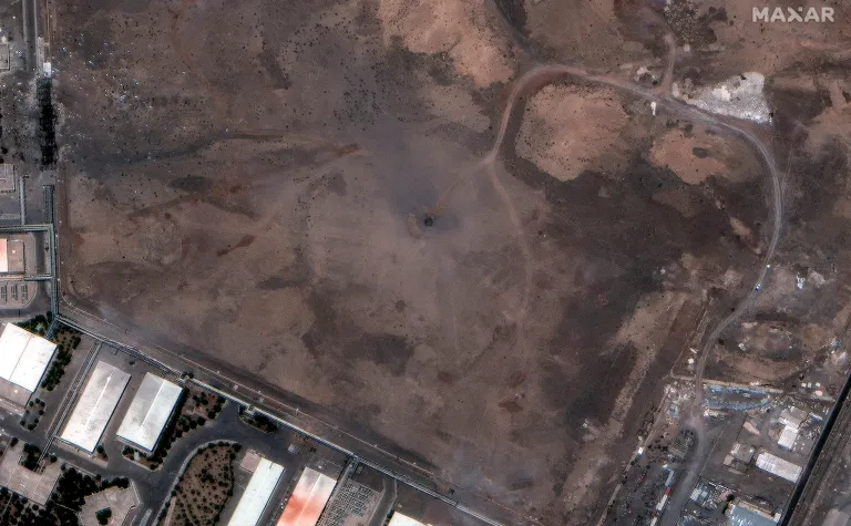 This satellite image provided by Maxar Technologies shows a crater over the underground Natanz enrichment facility in Iran after U.S. strikes, Sunday, June 22, 2025. (Maxar Technologies via AP)