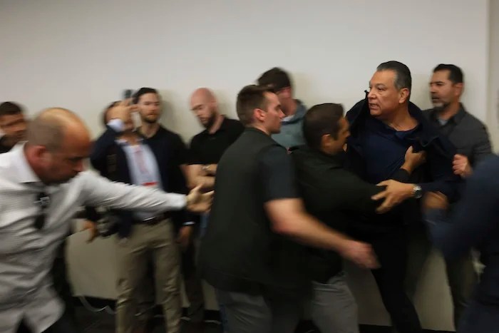 California Sen. Alex Padilla (D) is pushed out of the room as Homeland Security Secretary Kristi Noem holds a news conference regarding the recent protests in Los Angeles on Thursday, June 12, 2025.