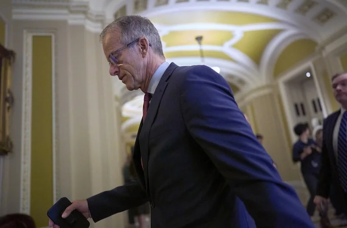 Senate Majority Leader John Thune (R-SD) arrives at the chamber as Republican senators meet to find a way to help President Donald Trump cancel $9.4 billion in spending already approved by Congress, at the Capitol in Washington, Wednesday, June 11, 2025.