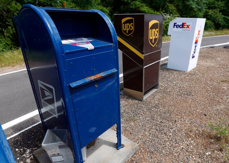 In this April 30, 2019 photograph, businesses in east Jackson, Miss., have a choice of delivery services ranging from FedEx, UPS and the U.S. Postal Service. (AP Photo/Rogelio V. Solis)