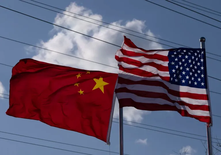 The Chinese and U.S. flags are flown outside the China International Supply Chain Expo in Beijing, Nov. 27, 2024.