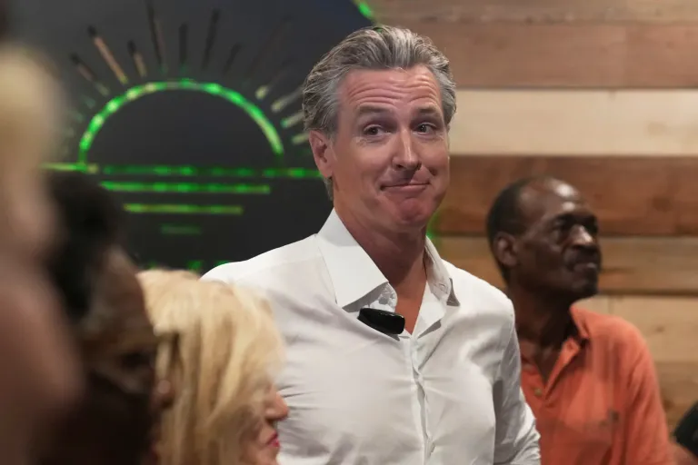 Gov. Gavin Newsom (D-CA) waits to speak to a crowd at a coffee shop during a two-day swing through South Carolina, Tuesday, July 8, 2025, in Mullins, South Carolina.