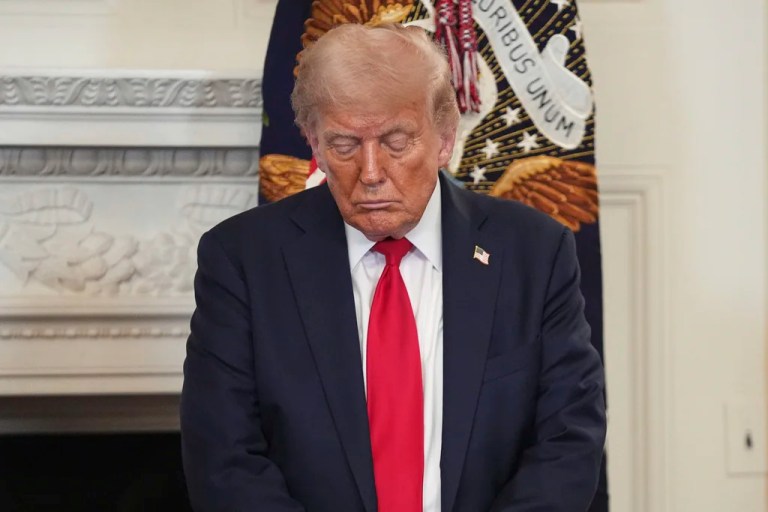 President Donald Trump bows his head in prayer during the White House Faith Office luncheon in the State Dining Room, Monday, July 14, 2025, in Washington. (AP Photo/Evan Vucci)