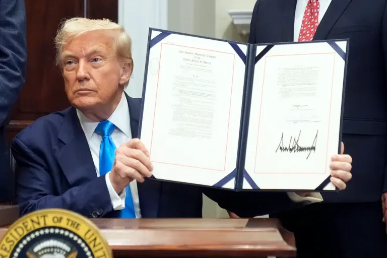 President Donald Trump signs the VA Home Loan Program Reform Act into law in the Roosevelt Room at the White House, Wednesday, July 30, 2025, in Washington. (AP Photo/Mark Schiefelbein)