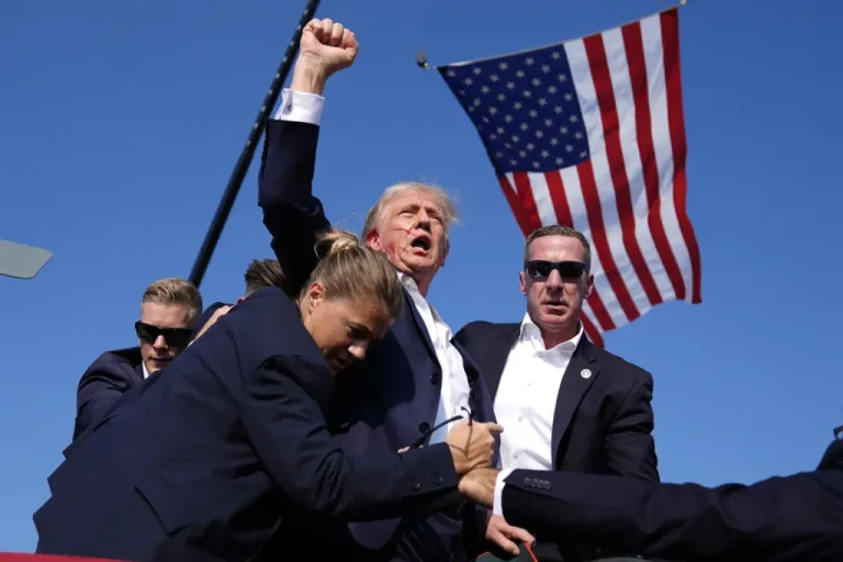 President Donald Trump surrounded by U.S. Secret Service agents