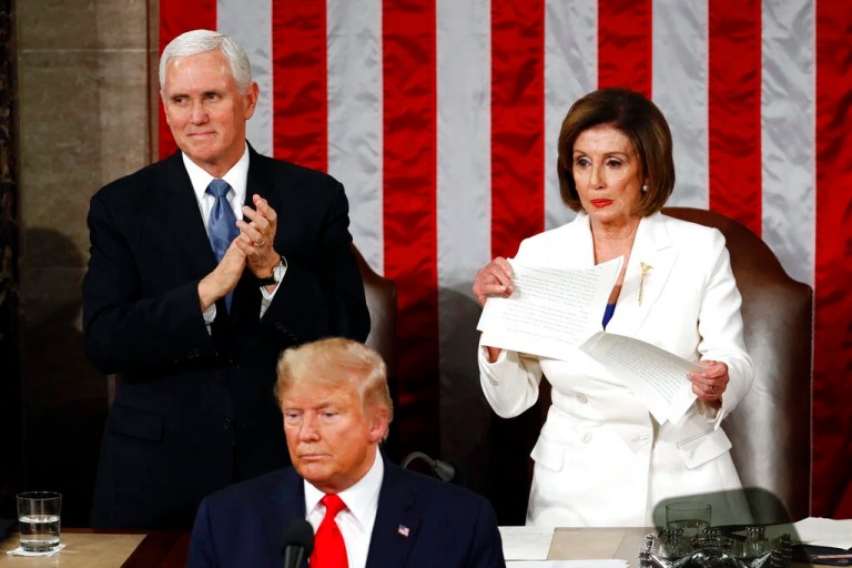 House Speaker Nancy Pelosi (D-CA) tears her copy of President Donald Trump's State of the Union address after he delivered it to a joint session of Congress on Capitol Hill in Washington, Tuesday, Feb. 4, 2020. Vice President Mike Pence is at left.